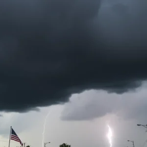 Dark clouds and heavy rainfall illustrating Memorial Day weekend thunderstorms