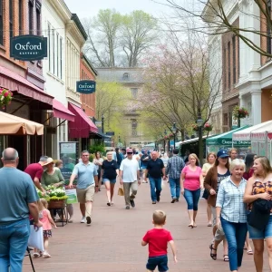Street festival in Oxford MS with people enjoying local food and arts.